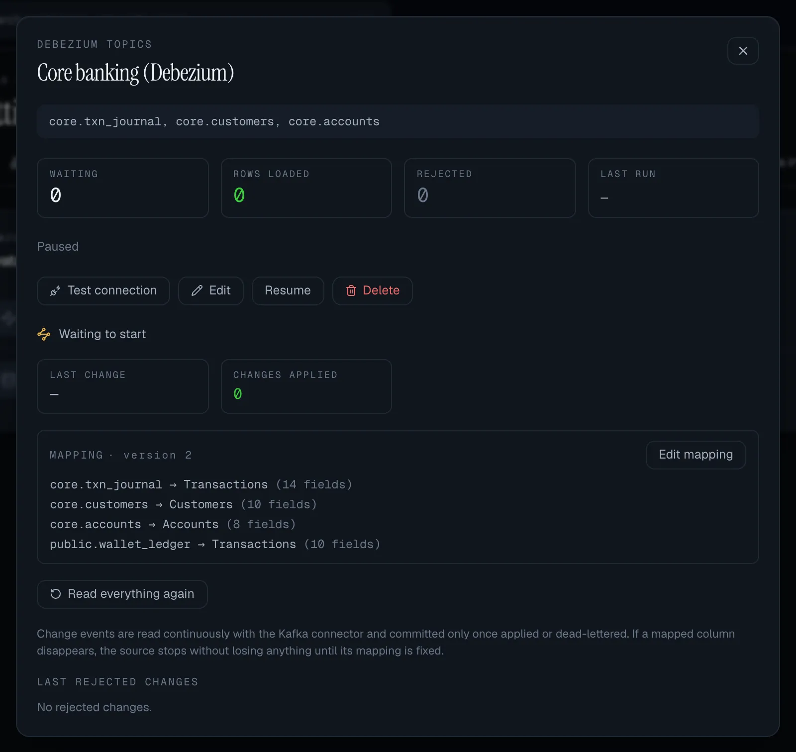 A paused Debezium topics source: Waiting to start, Last change and Changes applied tiles, Mapping version 2 listing core.txn_journal to Transactions (14 fields), core.customers to Customers, core.accounts to Accounts and public.wallet_ledger to Transactions, with Edit mapping and Read everything again