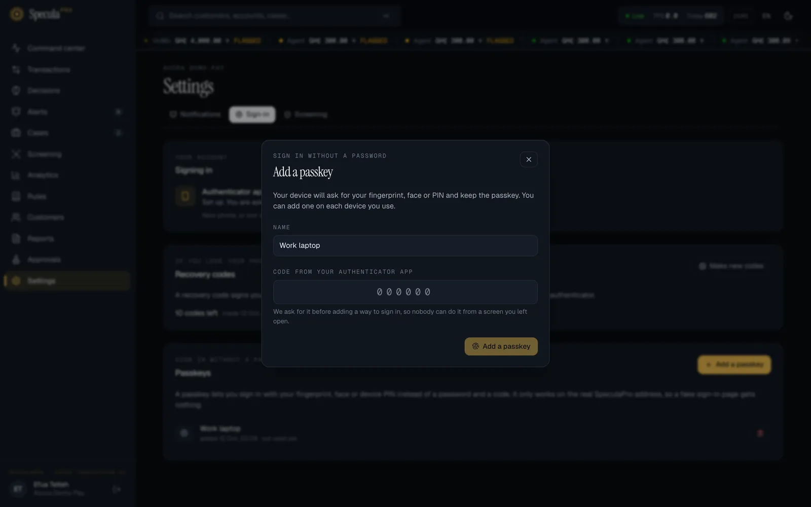 The Add a passkey dialog: a note that your device will ask for your fingerprint, face or PIN, a Name field filled with Work laptop, an empty Code from your authenticator app field, the explanation that the code is asked for so nobody can add a way to sign in from a screen you left open, and the Add a passkey button