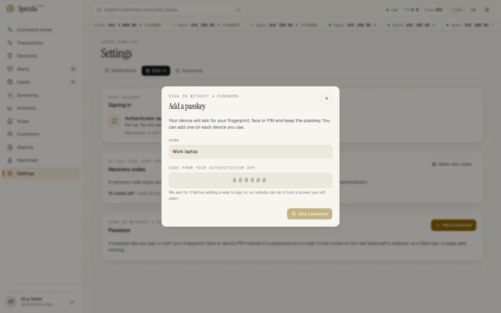 The Add a passkey dialog: a note that your device will ask for your fingerprint, face or PIN, a Name field filled with Work laptop, an empty Code from your authenticator app field, the explanation that the code is asked for so nobody can add a way to sign in from a screen you left open, and the Add a passkey button