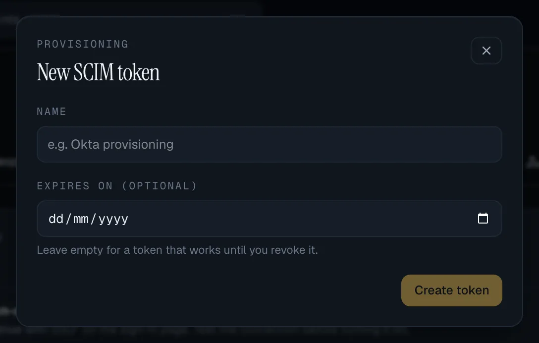 The New SCIM token sheet: a Name field with the example Okta provisioning, an optional Expires on date with the hint to leave it empty for a token that works until you revoke it, and a Create token button.