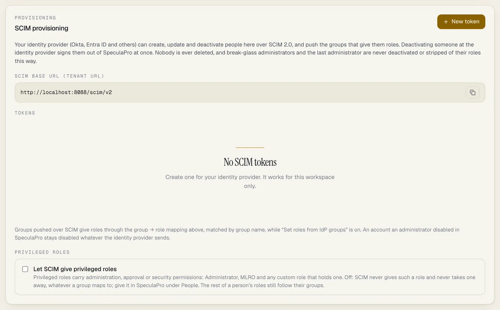 The SCIM provisioning panel on the Single sign-on tab: a New token button, a description of what the identity provider can do, the SCIM base URL (tenant URL) http://localhost:8088/scim/v2 with a copy button, an empty Tokens list reading No SCIM tokens, and under Privileged roles the tick box Let SCIM give privileged roles, not ticked